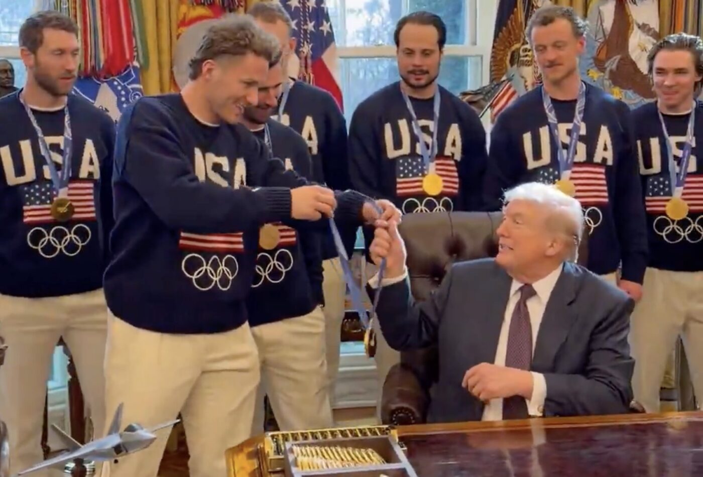 Team USA Men’s Hockey Team Enters The White House To “Free Bird,” Lets President Trump Try On Their Gold Medal
