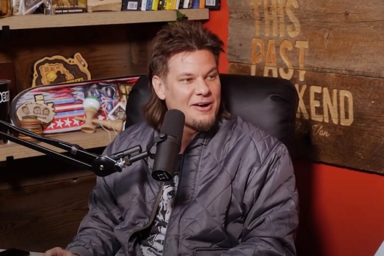 Theo Von holding a microphone