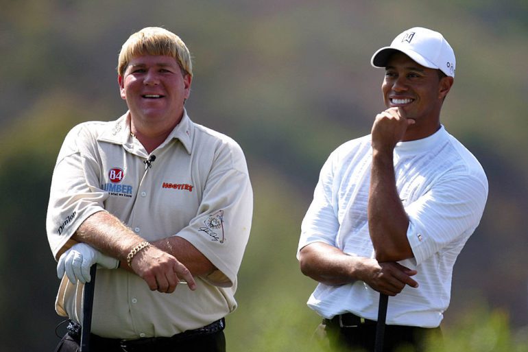 John Daly, Tiger Woods are posing for a picture