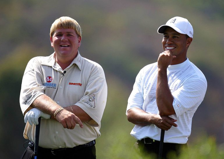 John Daly, Tiger Woods are posing for a picture