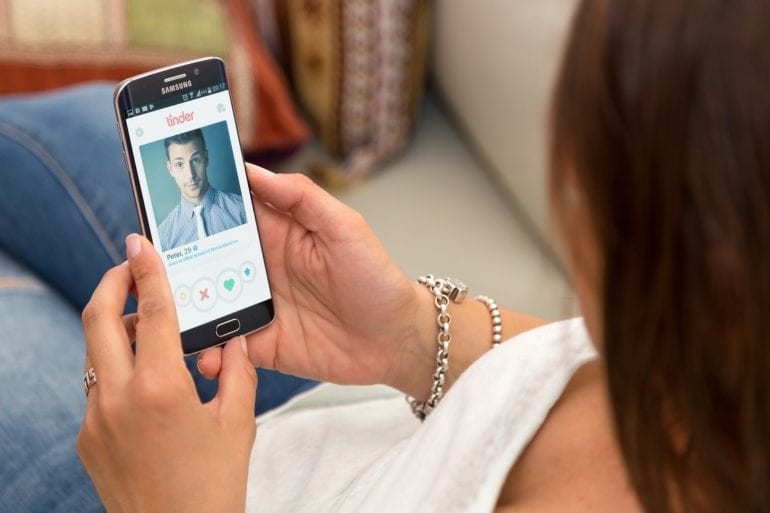 A woman holding a cell phone