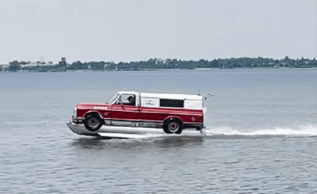 A car driving on a body of water