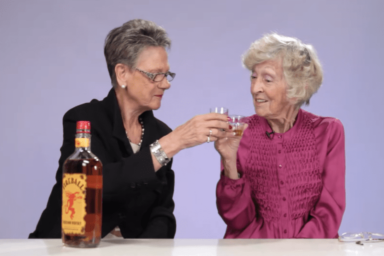 A couple of women drinking wine