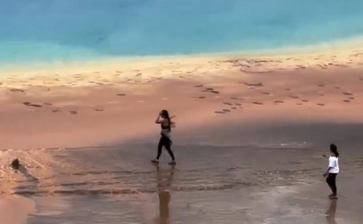 Reckless Tourists Walk Out On Grand Prismatic Hot Springs At Yellowstone National Park