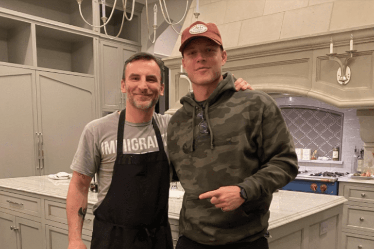 A couple of men posing for a picture