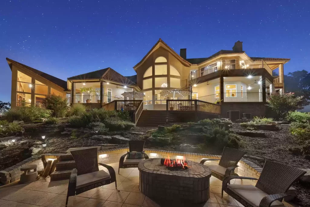 A large house with a fire pit