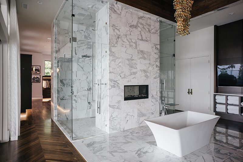 A room with a large glass shower