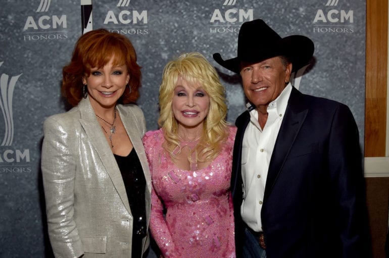 George Strait, Reba McEntire, Dolly Parton posing for a photo