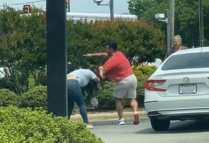 A man kicking another man off the ground