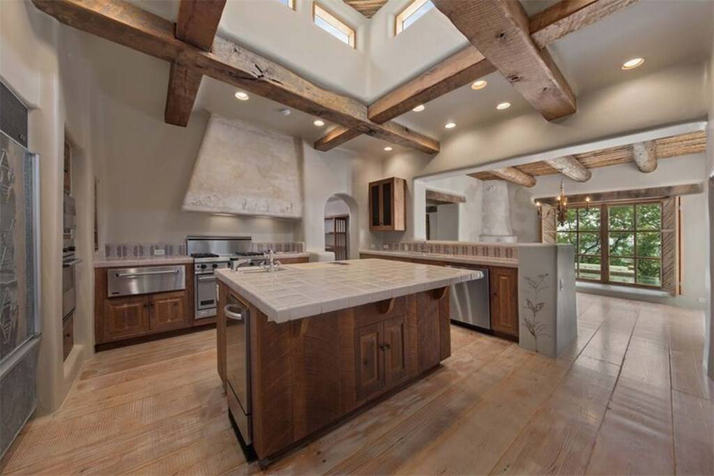 A large kitchen with wooden cabinets