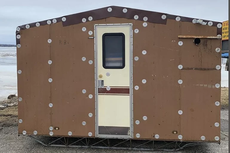 A wooden container with a door