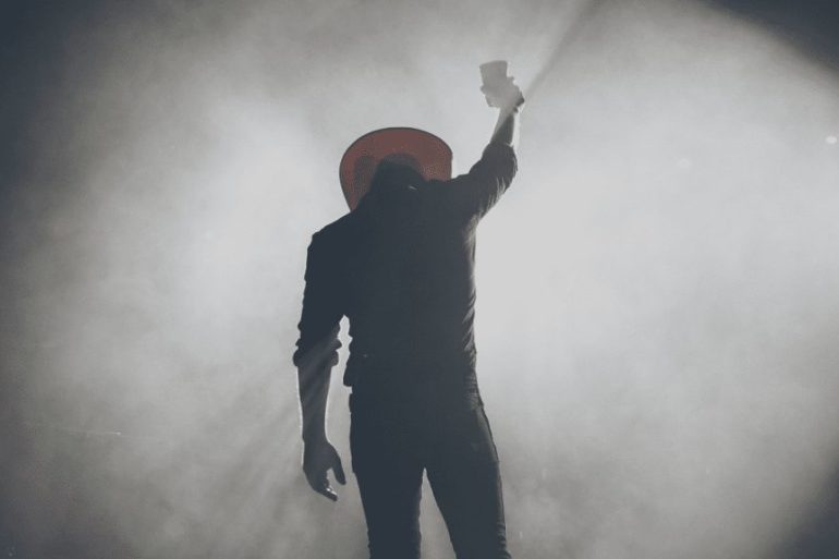 A man holding a light saber