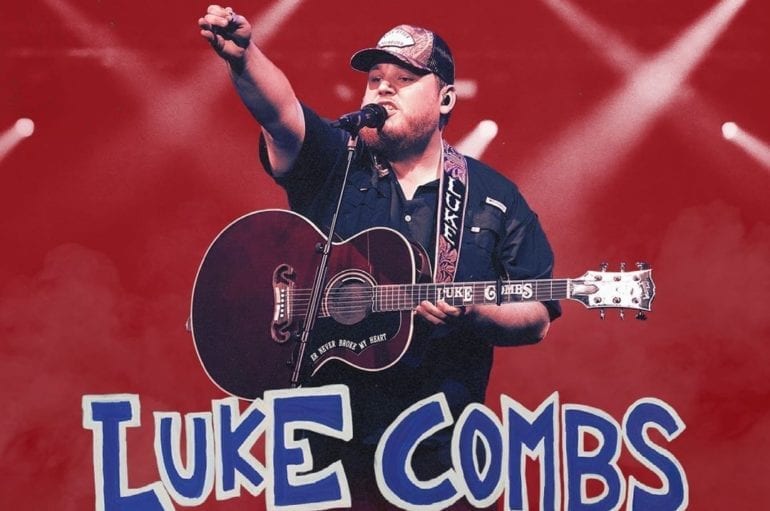 Luke Combs playing a guitar