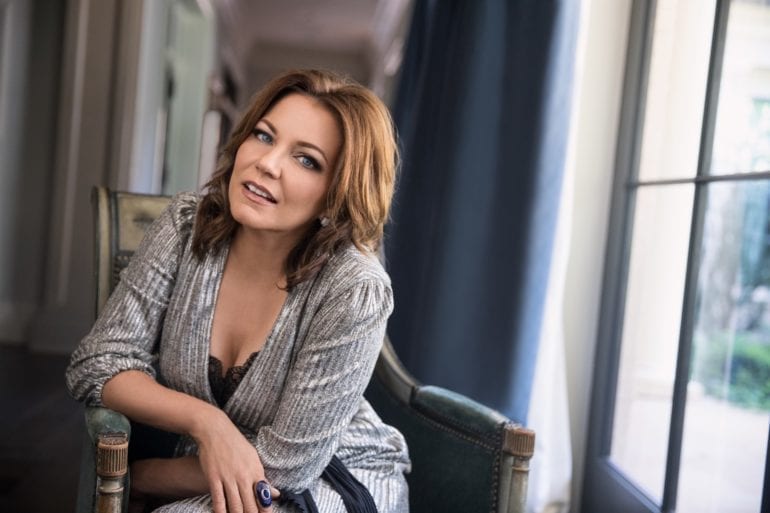 Martina McBride sitting in a chair