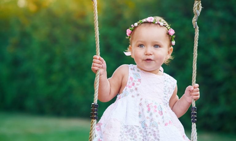 A little girl on a swing